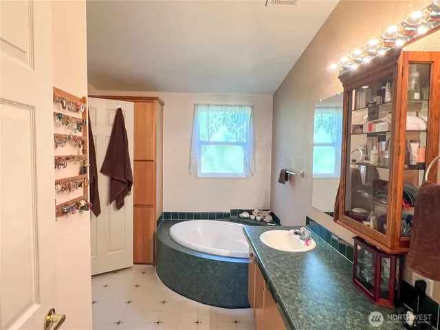 a white toilet sitting next to a shower