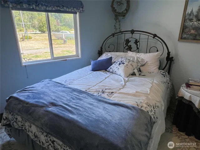 a bathroom with a toilet a sink and a shower curtain