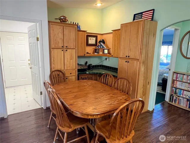 a view of a porch with chairs and backyard