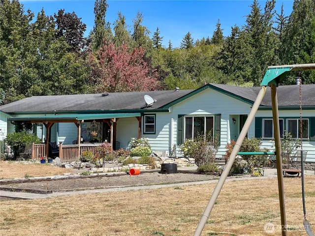 front view of a house with a big yard