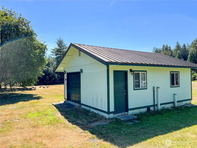 a kitchen with stainless steel appliances a stove a sink and a refrigerator