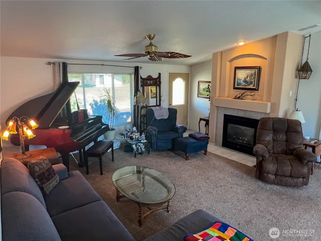 a kitchen with a stove a sink a refrigerator and a dining table