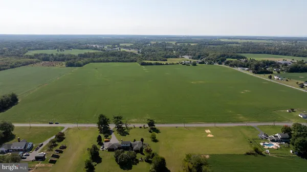 an aerial view of a houses with a lake view