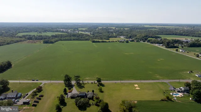 an aerial view of a houses with a lake view