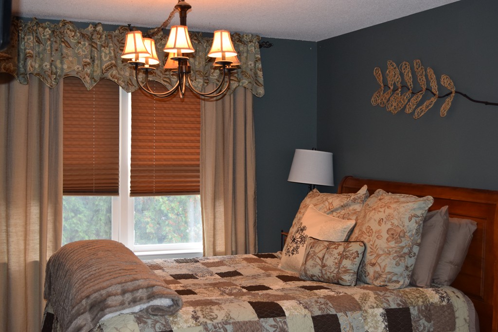 54 Luden Street Springfield, MA 01118 - Photo 13 of 24 a bedroom with a bed dresser and window
