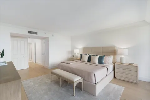 a bedroom with a bed and a table