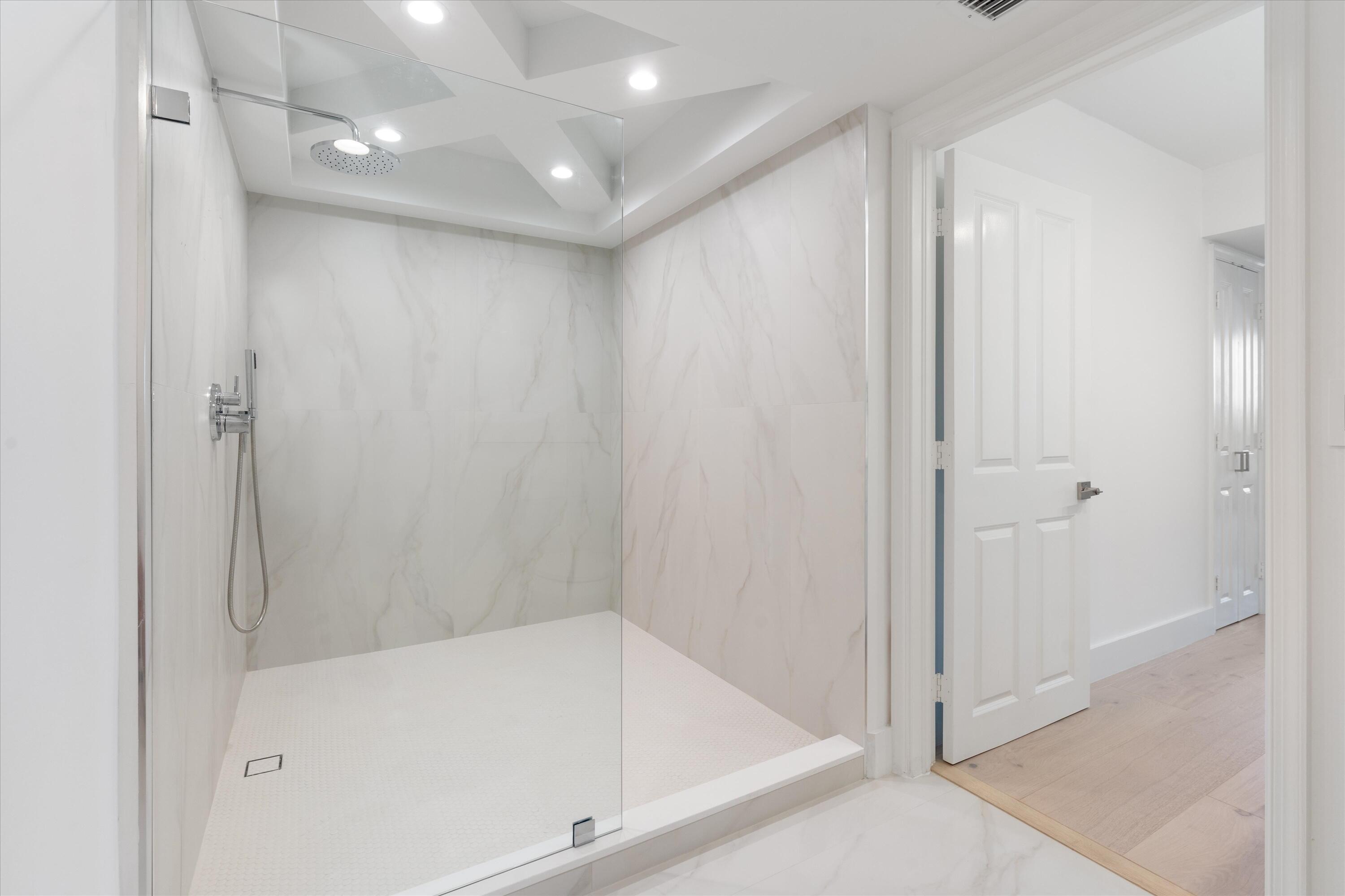 1800 South Ocean Boulevard, Unit 4B Boca Raton, FL 33432 - Photo 20 of 39 a bathroom with a bathtub and a shower