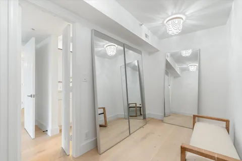 a view of a hallway with a bathroom