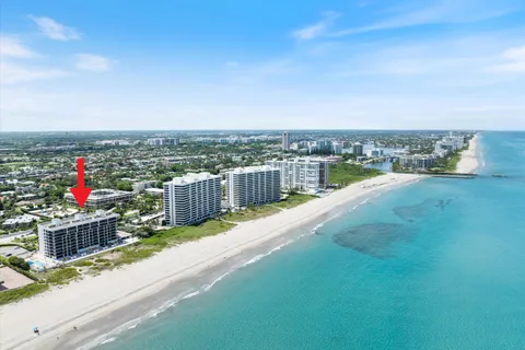 a view of a balcony with city and ocean view