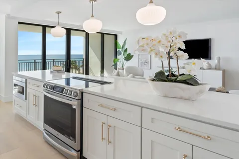 a kitchen with stainless steel appliances white cabinets and a granite counter tops