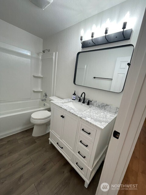 7438 Mullen Road Southeast, Unit AB Lacey, WA 98503 - Photo 13 of 37 a bathroom with a sink double vanity and a mirror
