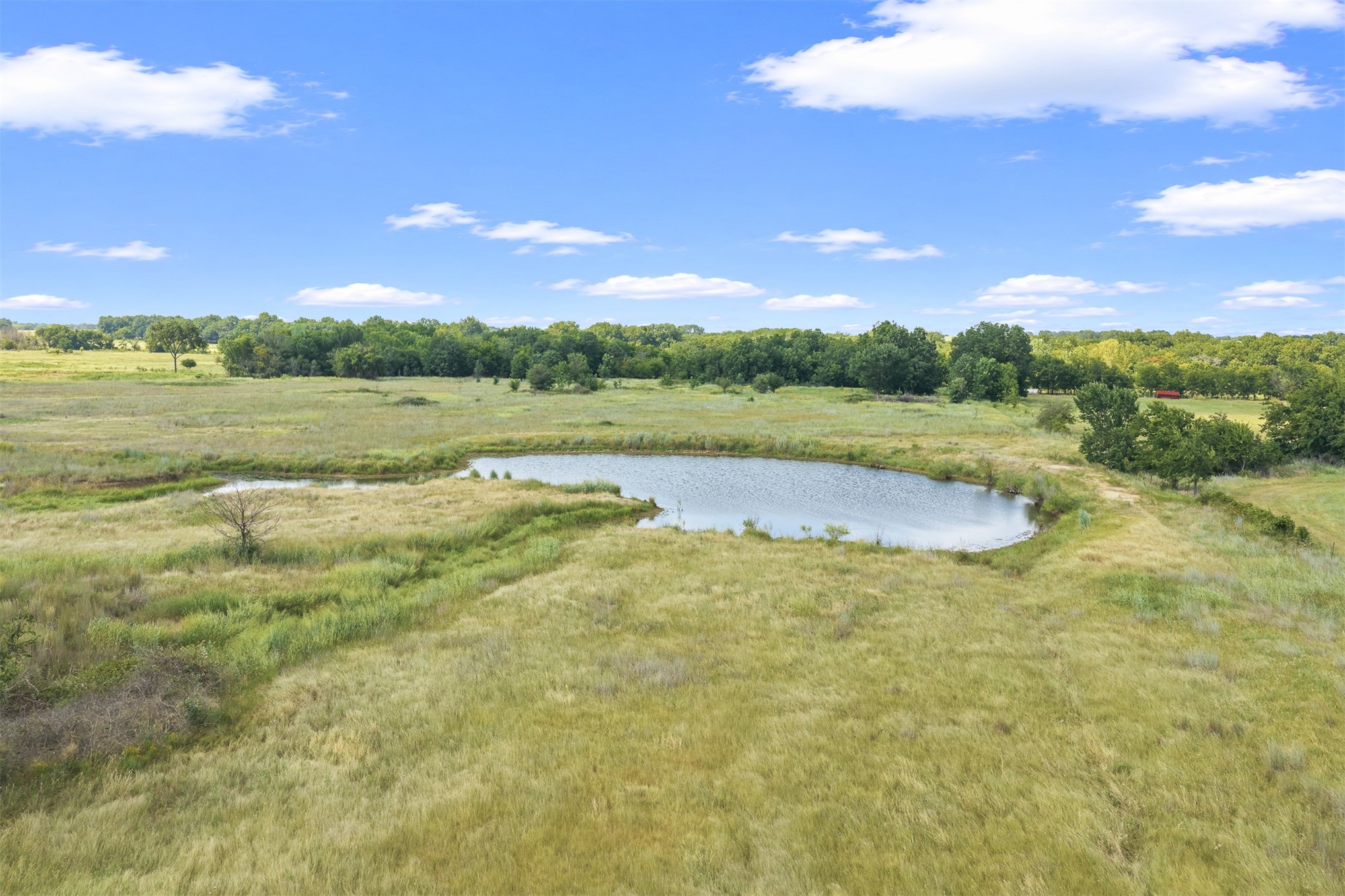 4 Keller Road Wilson, OK 73463 - Photo 16 of 32 Expansive land with a natural pond and surrounding fields