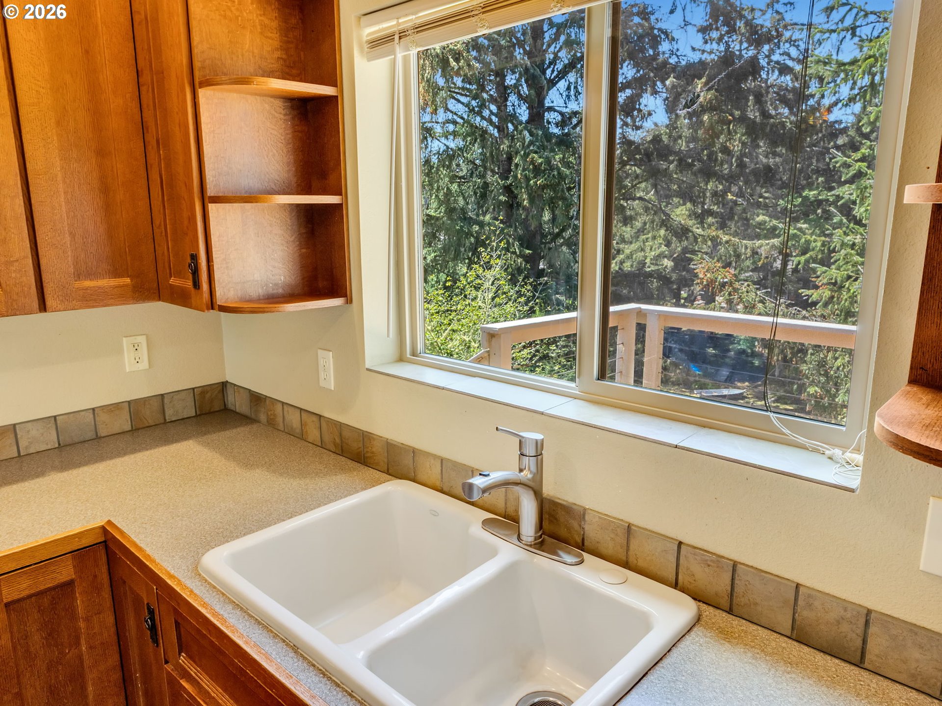 1077 Southwest Ridge Road Warrenton, OR 97146 - Photo 22 of 46 a bathroom with a sink and a large window