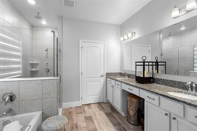 a bedroom with a bed and a lamp on table