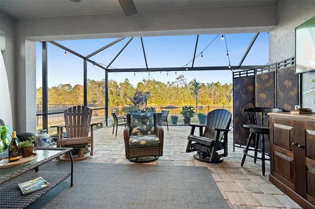 a outdoor space with chairs a stove and a shower