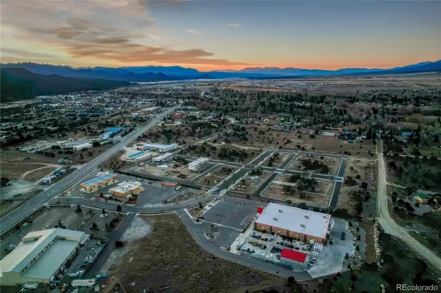 an aerial view of residential houses with city view