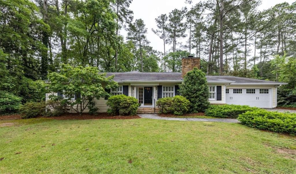 15 Ridgewood Road Southwest Rome, GA 30165 - Photo 1 of 1 a front view of a house with garden