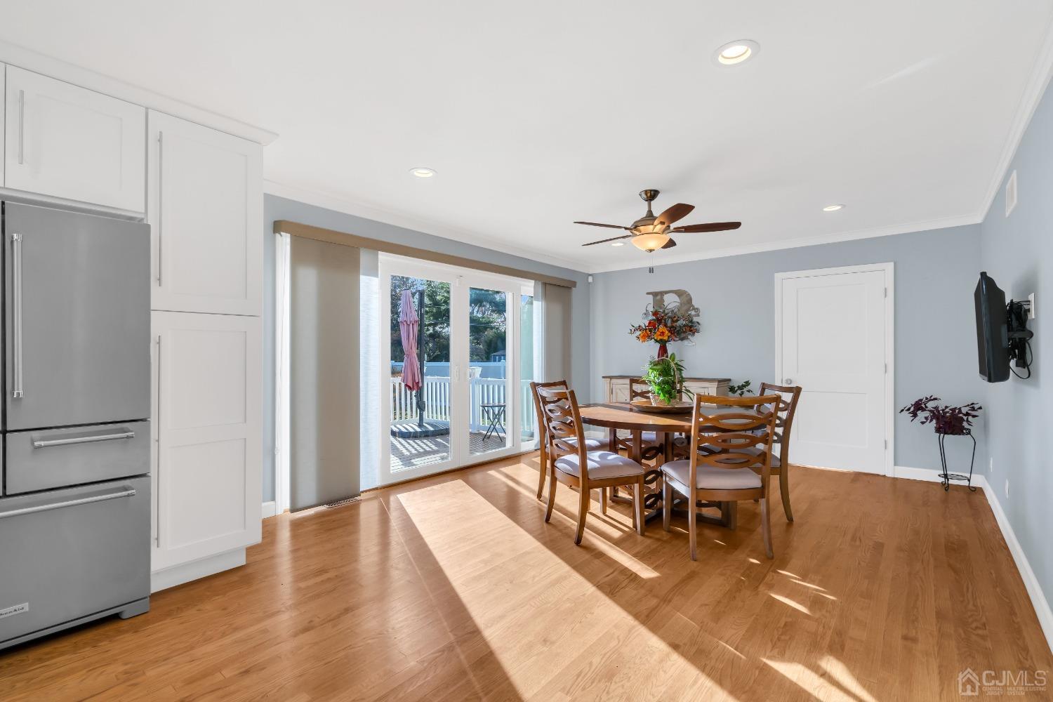 116 Grovers Mill Road Plainsboro, NJ 08536 - Photo 14 of 78 a dining room with furniture a rug a potted plant and a chandelier