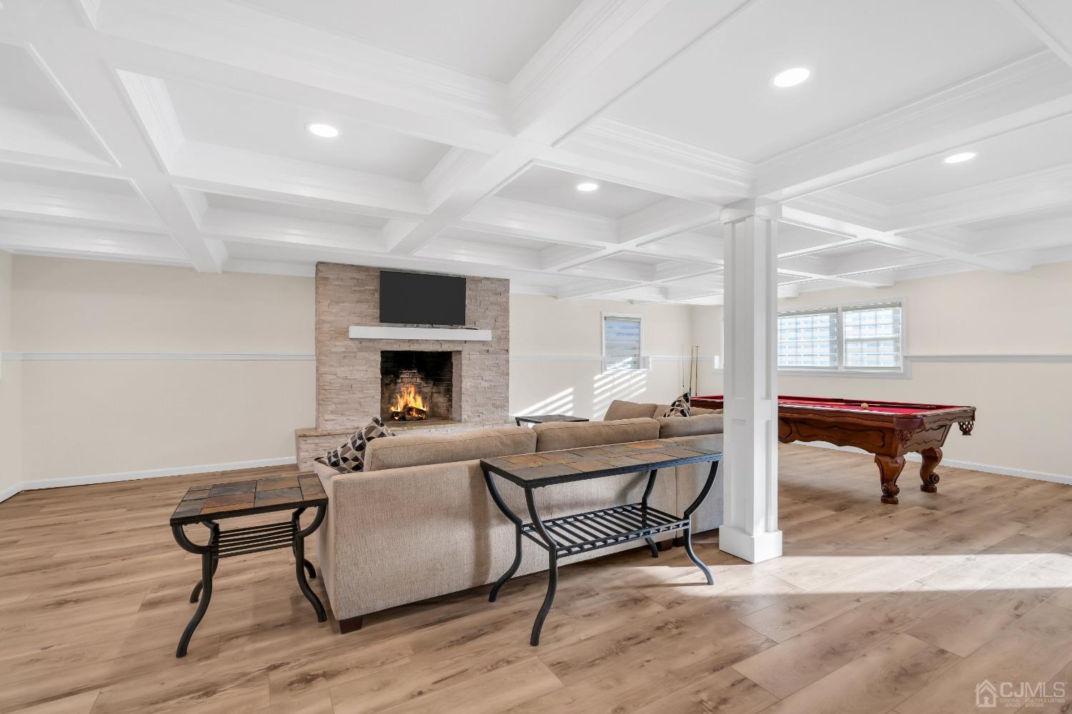 116 Grovers Mill Road Plainsboro, NJ 08536 - Photo 24 of 78 a living room with furniture a fireplace and a table