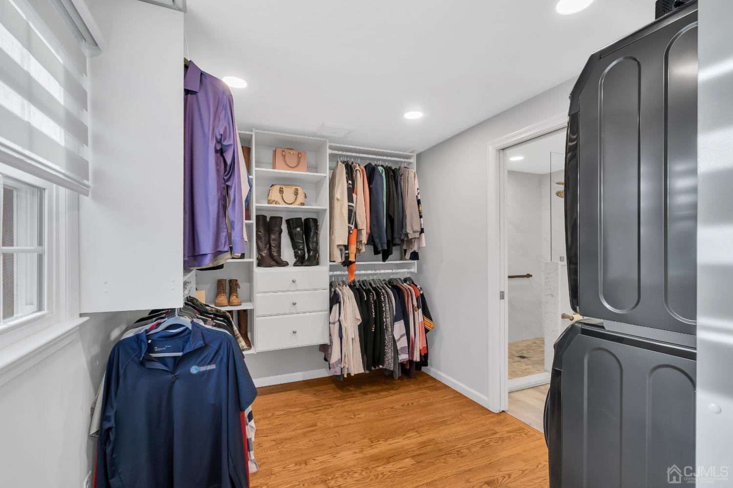 116 Grovers Mill Road Plainsboro, NJ 08536 - Photo 34 of 78 a view of walk in closet with clothes and shoes