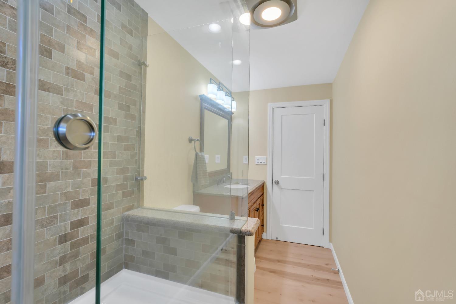 116 Grovers Mill Road Plainsboro, NJ 08536 - Photo 45 of 78 a bathroom with a glass shower door