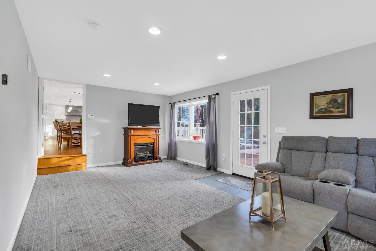 116 Grovers Mill Road Plainsboro, NJ 08536 - Photo 46 of 78 a living room with furniture and a flat screen tv