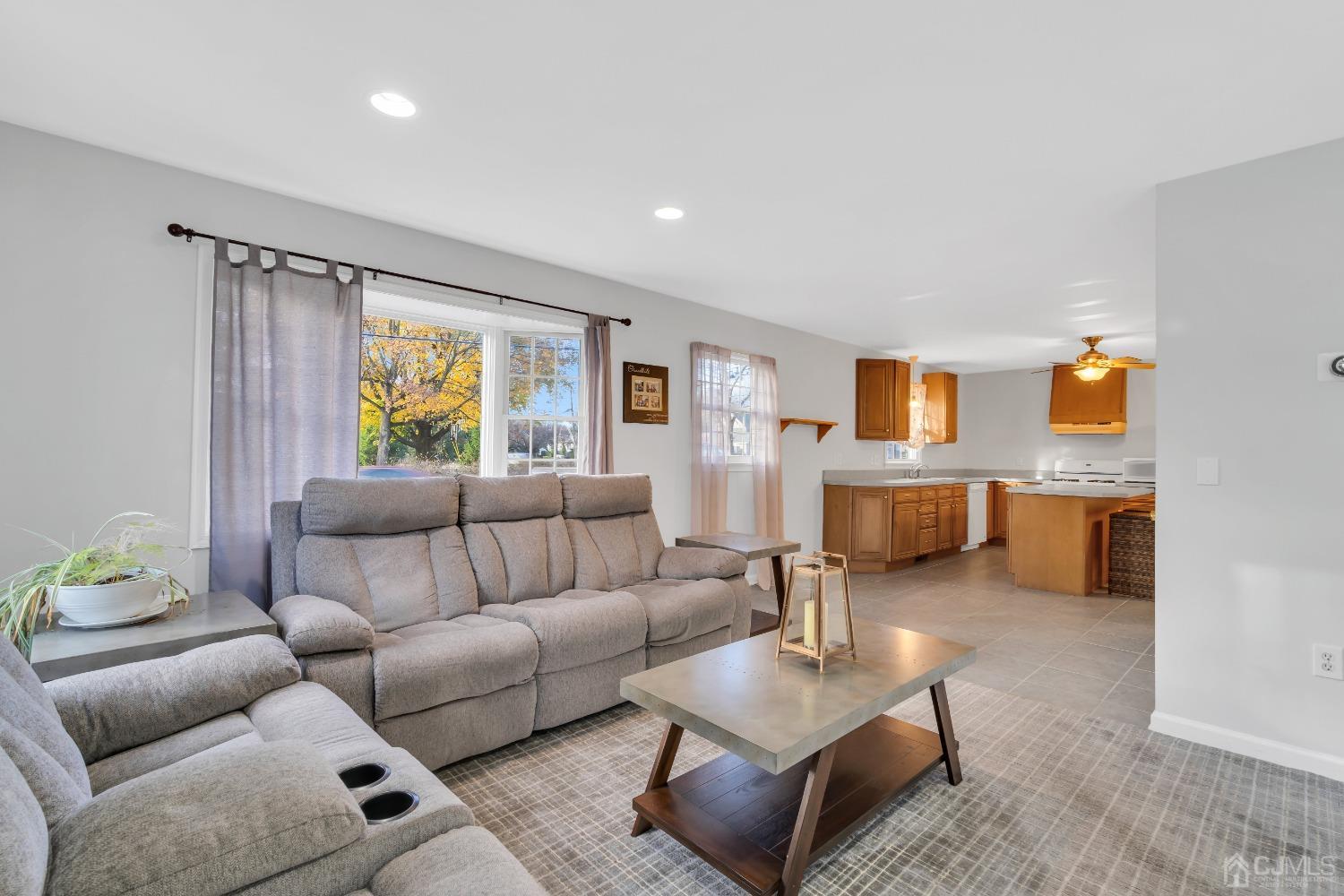 116 Grovers Mill Road Plainsboro, NJ 08536 - Photo 49 of 78 a living room with furniture and a flat screen tv