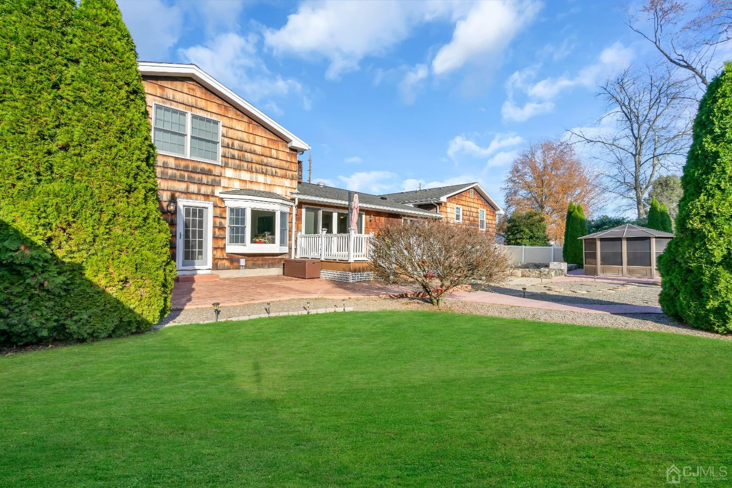 116 Grovers Mill Road Plainsboro, NJ 08536 - Photo 70 of 78 a view of a house with a backyard and a patio