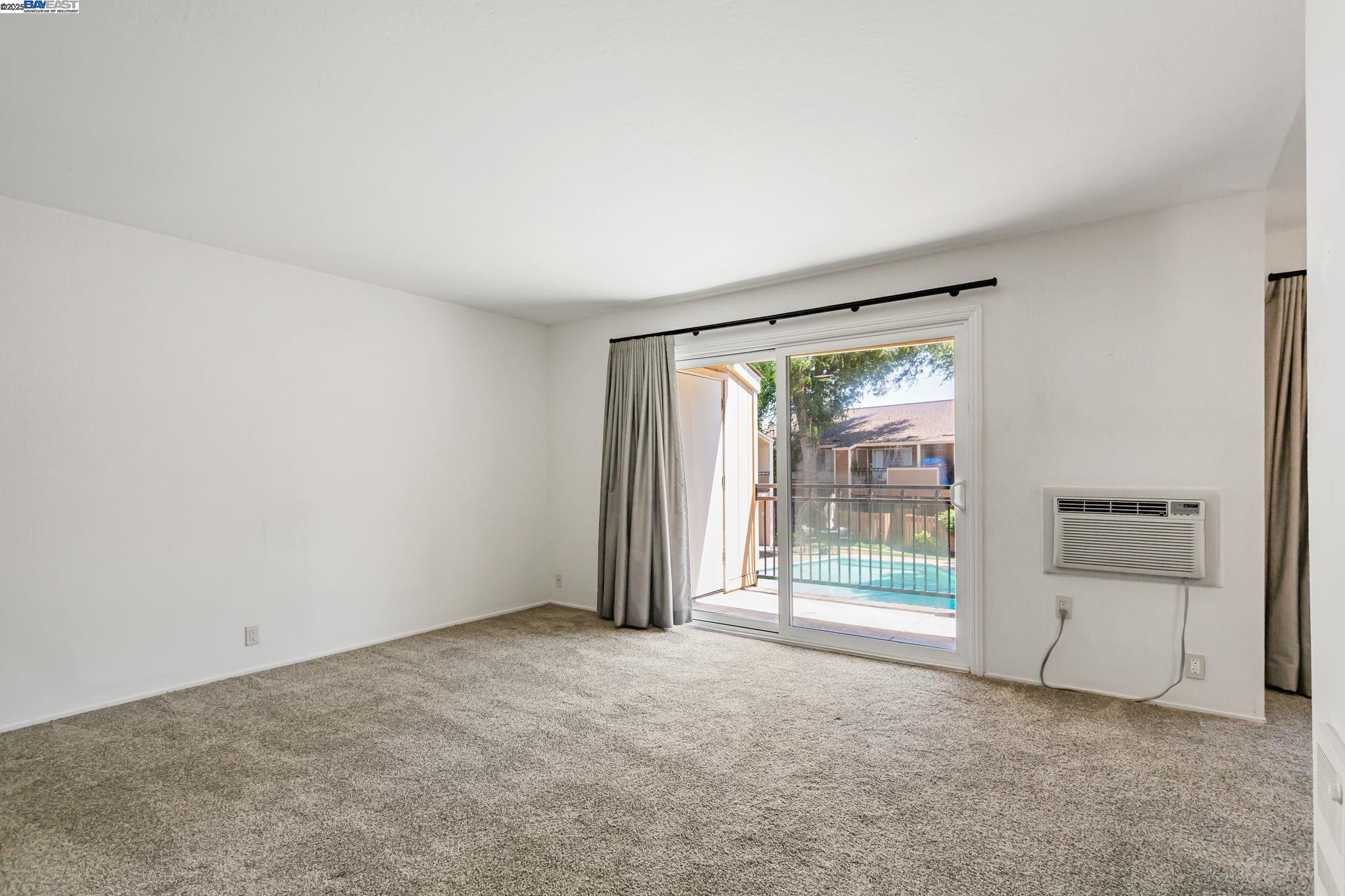 8975 Alcosta Boulevard, Unit 104 San Ramon, CA 94583 - Photo 11 of 42 an empty room with windows