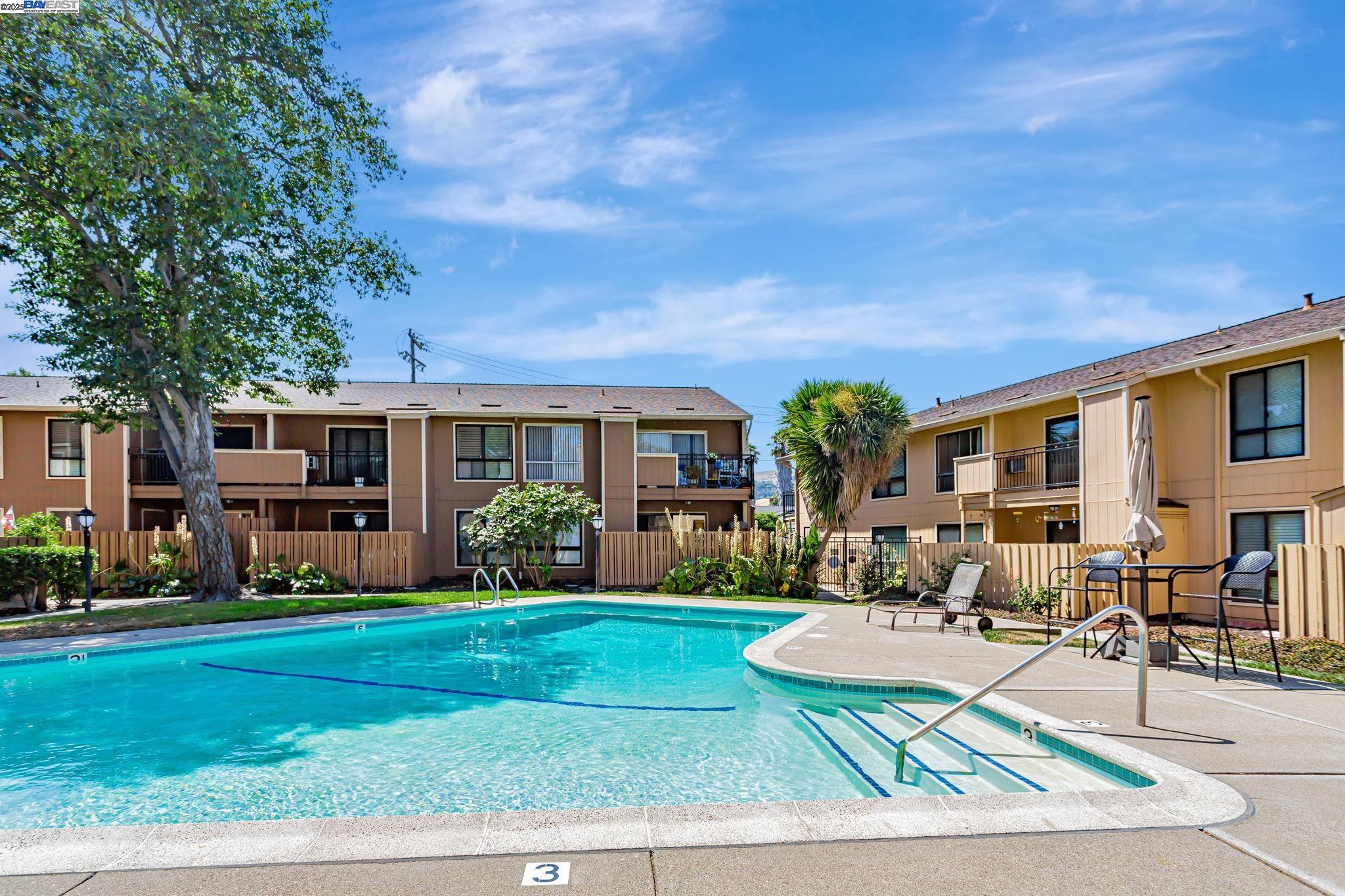 8975 Alcosta Boulevard, Unit 104 San Ramon, CA 94583 - Photo 30 of 42 a front view of house with yard and green space