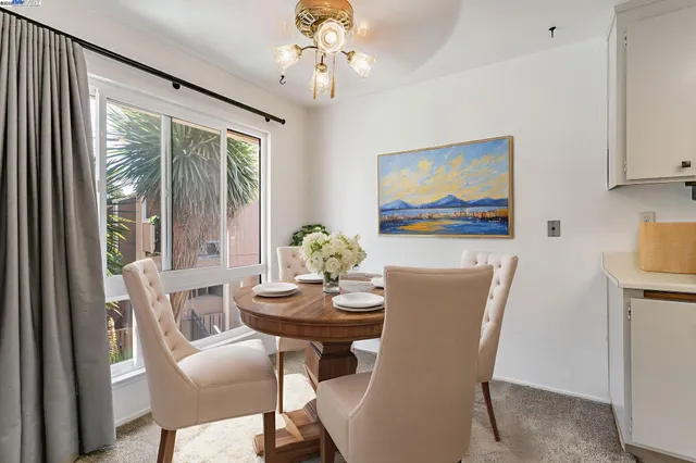 a view of a dining room with furniture window and outside view