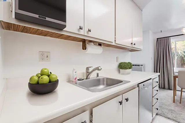 a kitchen with a sink and cabinets