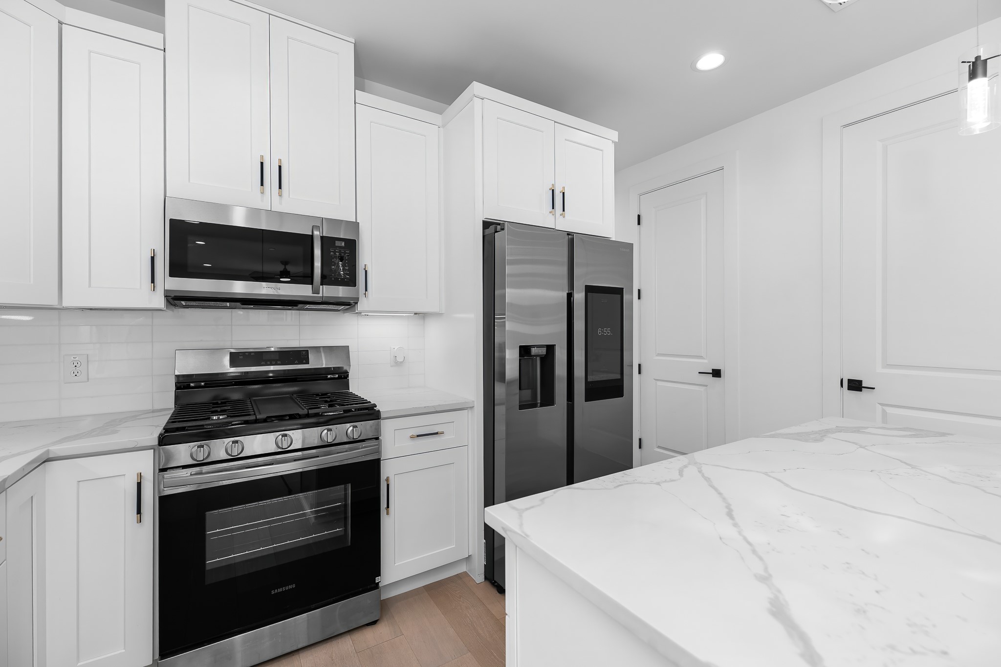5305 Ledesma Road, Unit 4 Austin, TX 78721 - Photo 15 of 40 White cabinetry, new appliances, and ample counter space outfit this well-appointed kitchen.