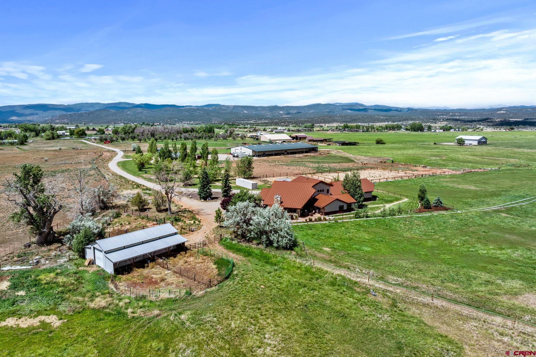 an aerial view of a houses with outdoor space and lake view