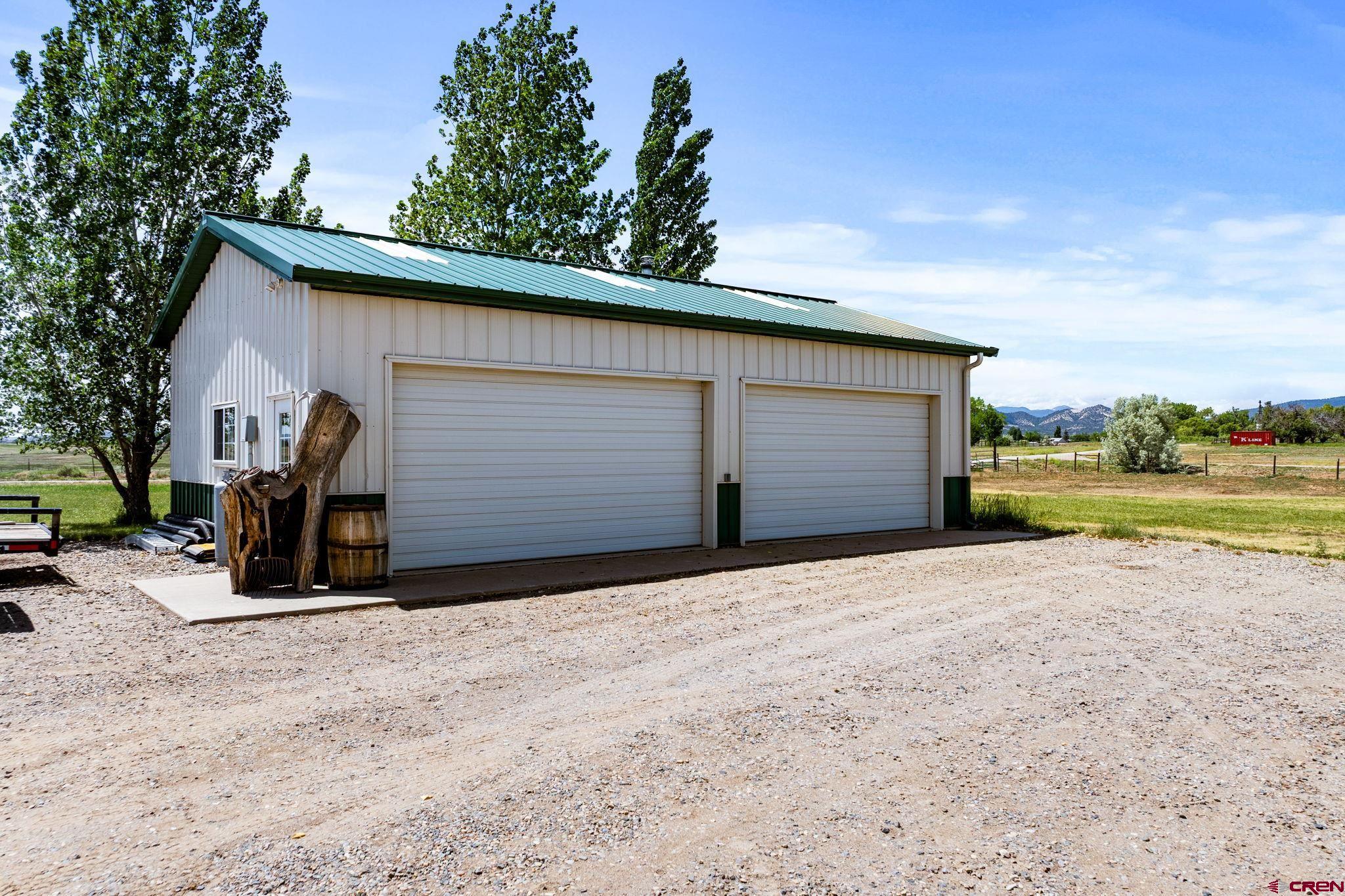 616 Cole Ranch Road Durango, CO 81303 - Photo 15 of 43 a view of backyard of house and car parked