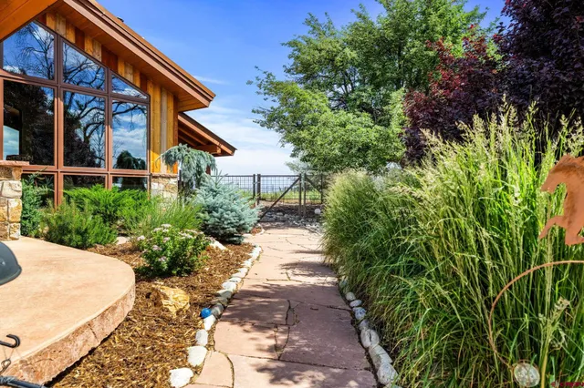 a living room with fireplace furniture and a large window
