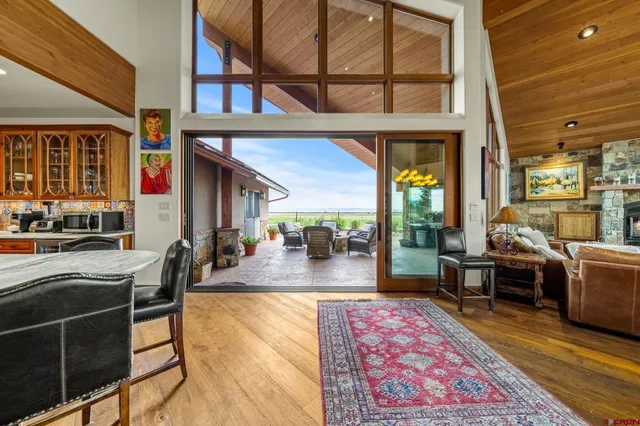 a view of an chairs and table in the balcony