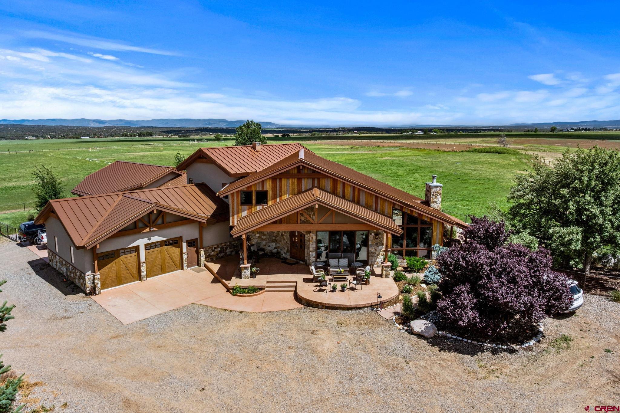 616 Cole Ranch Road Durango, CO 81303 - Photo 2 of 43 a view of a patio with swimming pool and porch