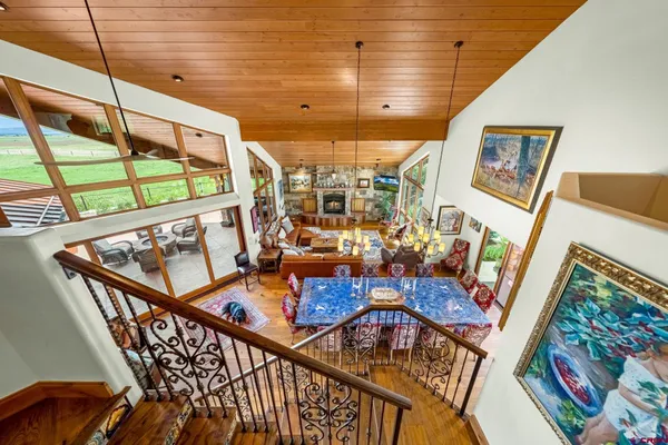 a living room with lots of furniture and a rug