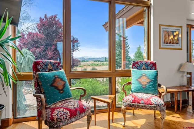 a view of a patio with table and chairs