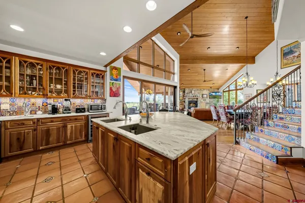 a dining room with furniture wooden floor and chandelier