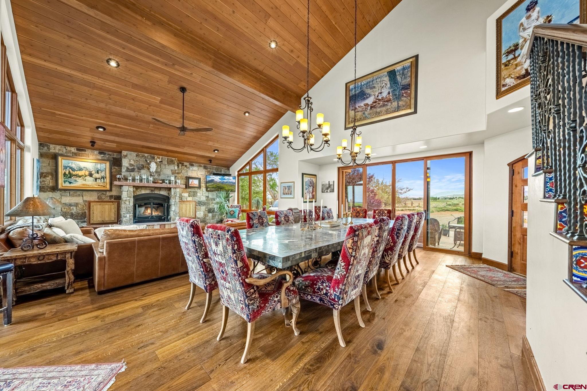 616 Cole Ranch Road Durango, CO 81303 - Photo 27 of 43 a dining room with furniture wooden floor and chandelier