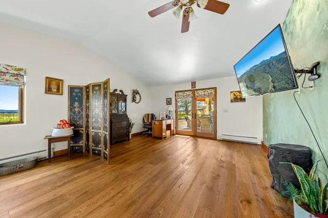 a room with furniture pool table and flat screen tv