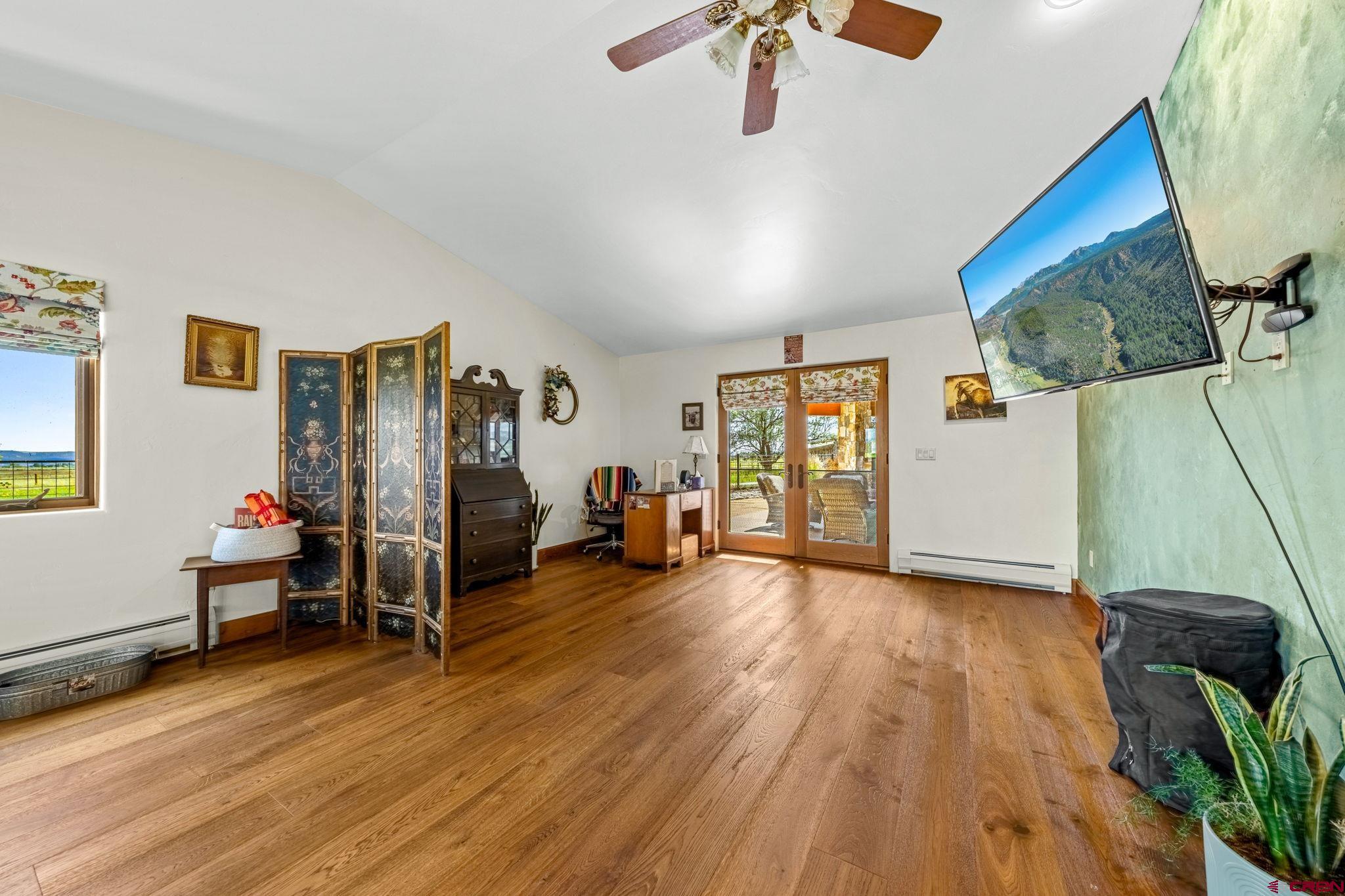 616 Cole Ranch Road Durango, CO 81303 - Photo 30 of 43 a view of a livingroom with furniture and a flat screen tv
