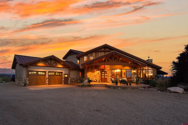 a view of a big house with a large windows