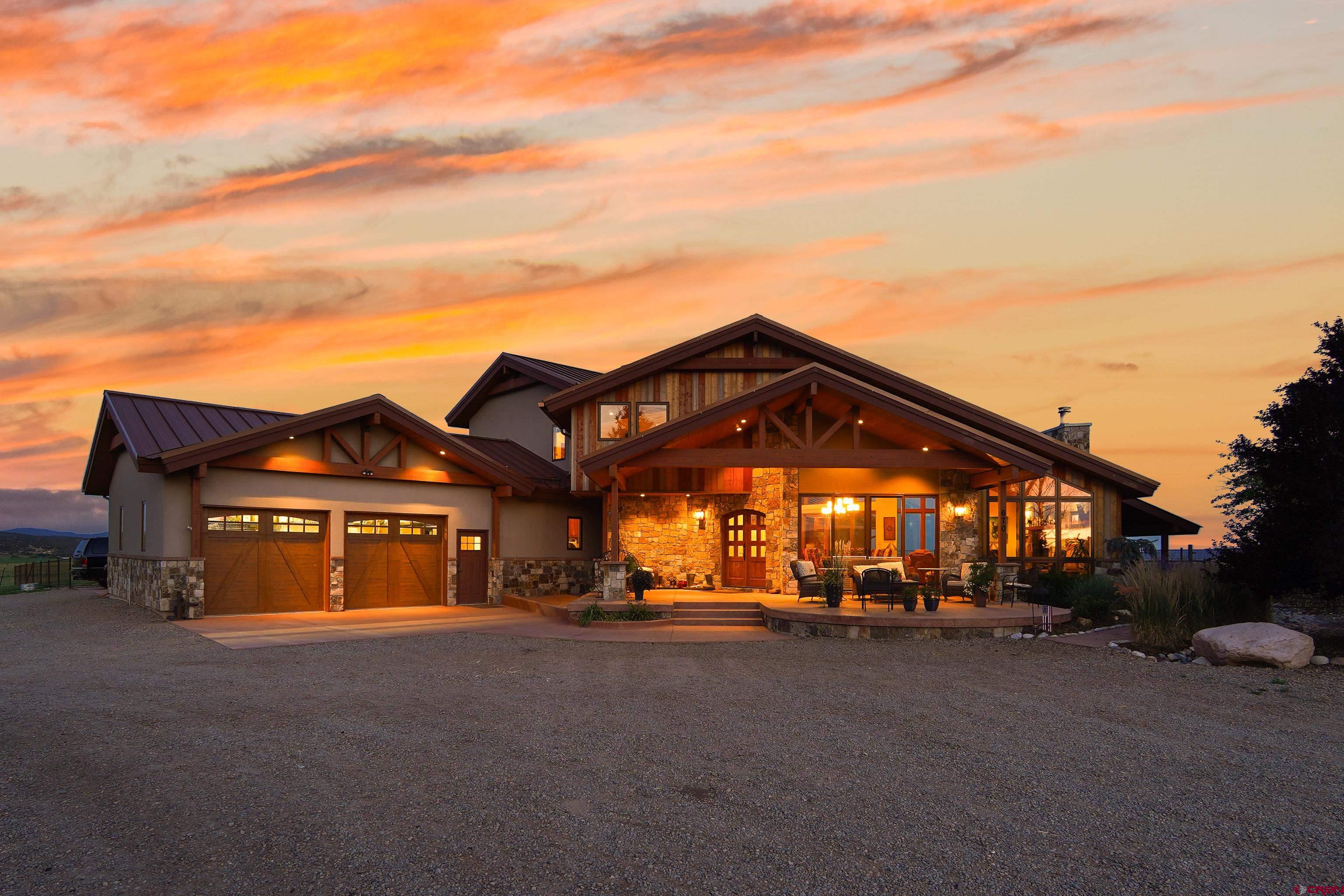 616 Cole Ranch Road Durango, CO 81303 - Photo 3 of 43 a view of a big house with a large windows