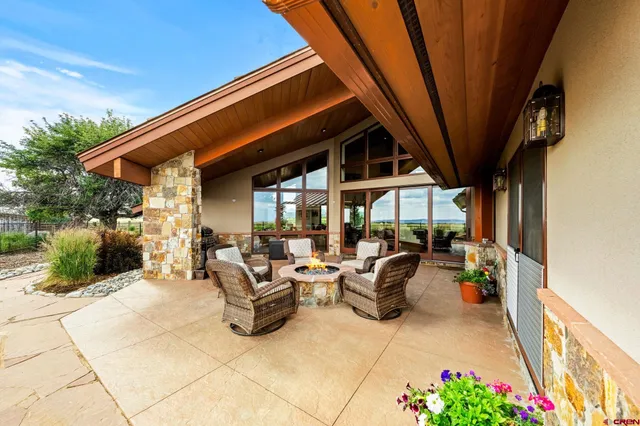 a living room with furniture ceiling fan and a window