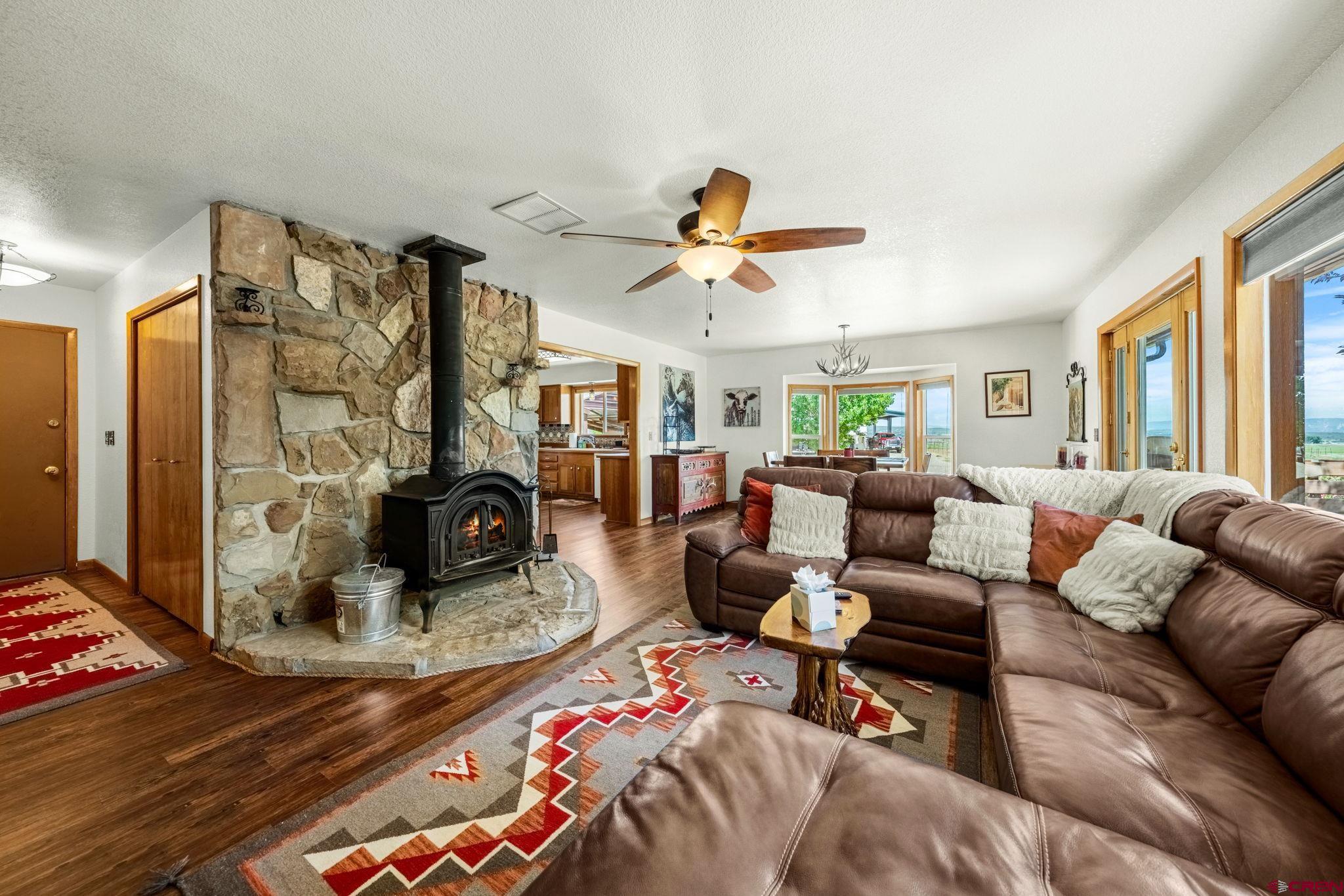 616 Cole Ranch Road Durango, CO 81303 - Photo 36 of 43 a living room with furniture ceiling fan and a window