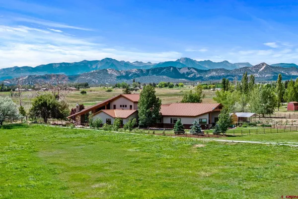 a view of a town with mountains in the background