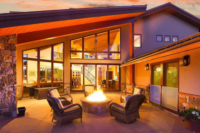 a living room with lots of furniture and wooden floor